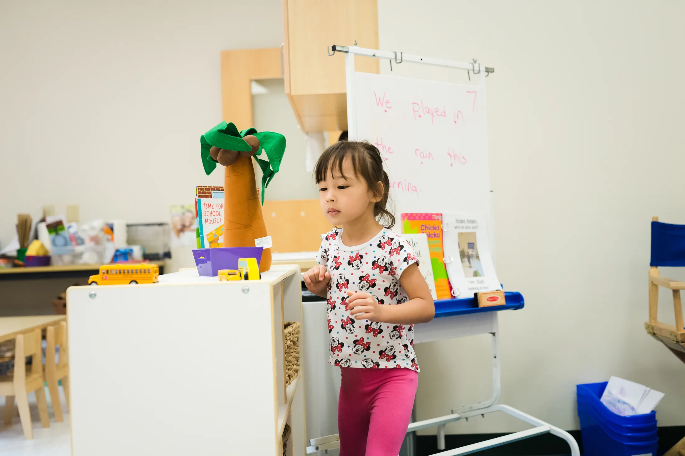 An educator working with children in an early learning classroom